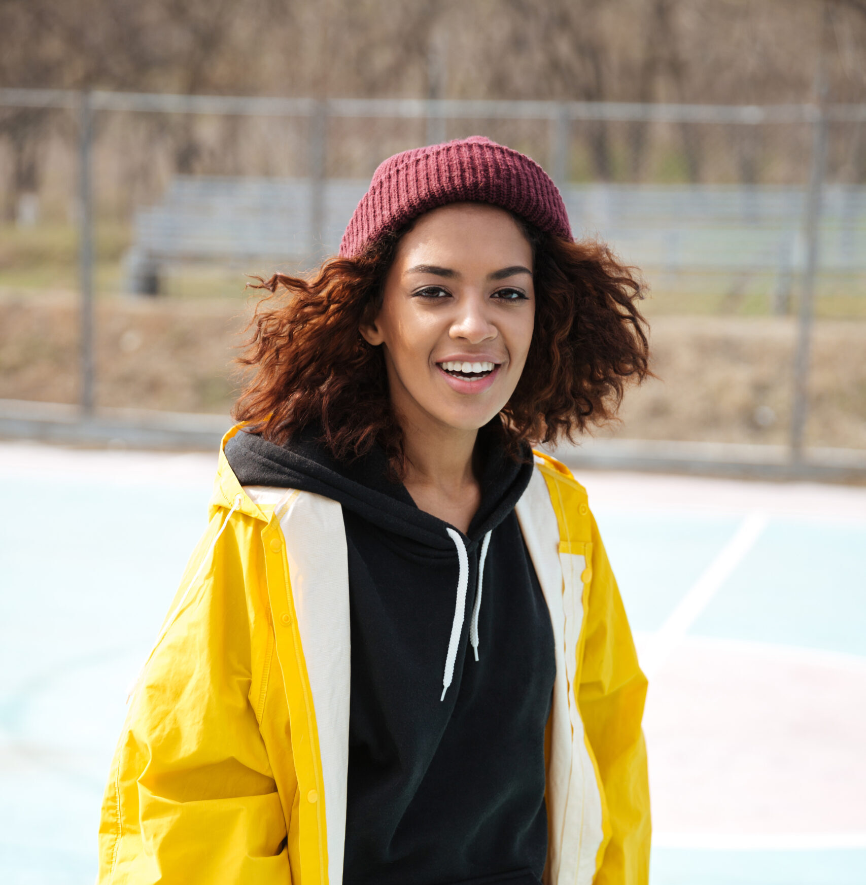 Home happy african young lady walking outdoors